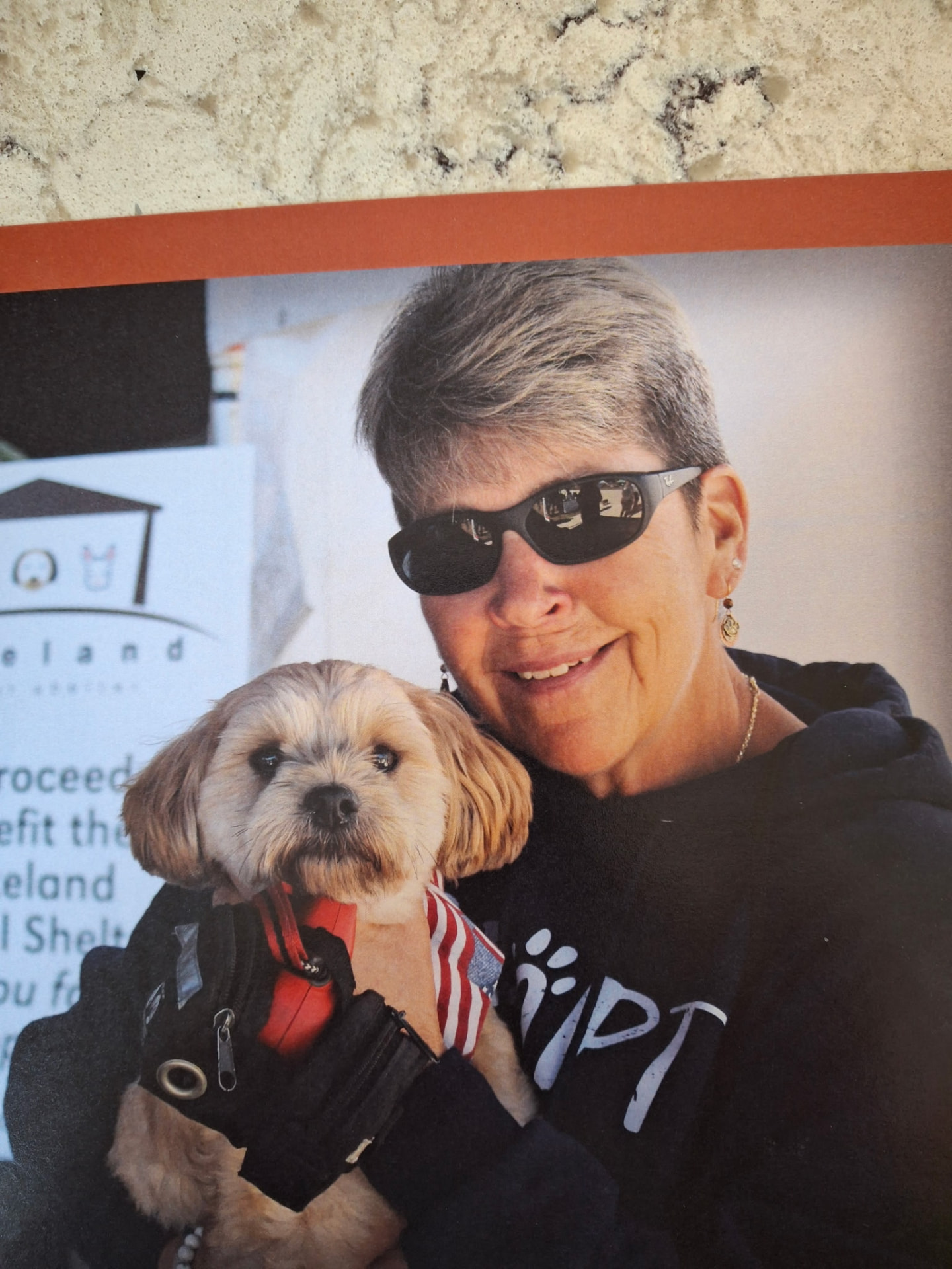 Nina holding Buckshot at a shelter fundraiser